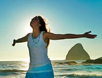 woman in recovery from eating disorder at the beach