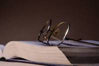 Medical book with glasses on it