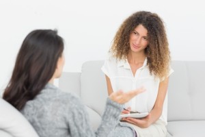 Therapist listening to her talking patient