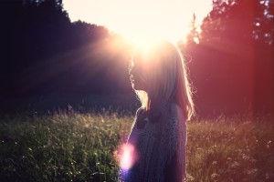 Lady standing in sunrise