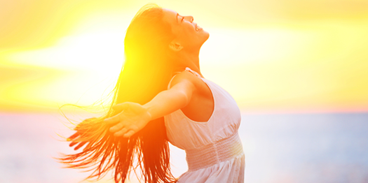 Happy Young Woman in the Sunlight with good Body Image