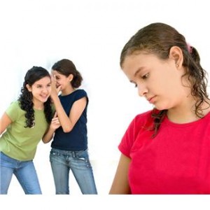 Young girls bulling another kid.