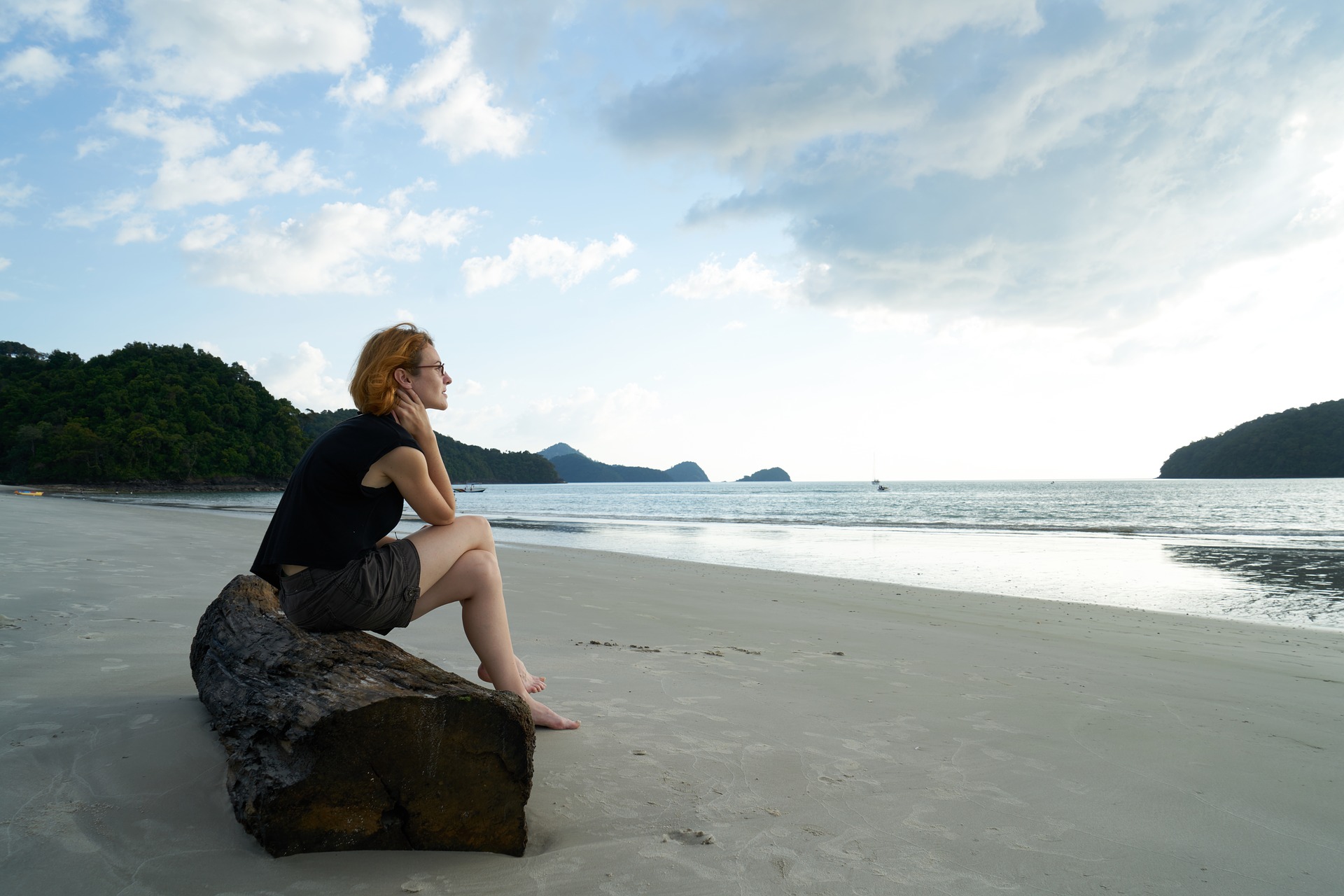 Woman Sitting On The Beach