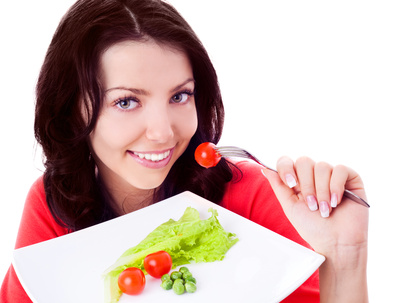 Woman eating vegetables