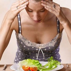 Brain and Eating Disorders Young Woman Eating A Salad