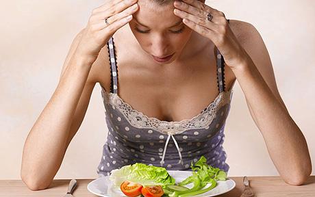 Brain and Eating Disorders Young Woman Eating A Salad