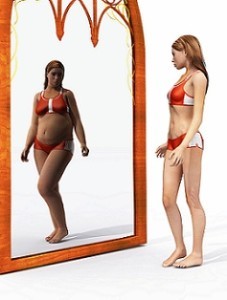 Woman seeing a different picture in the mirror with Body Dysmorphic Disorder
