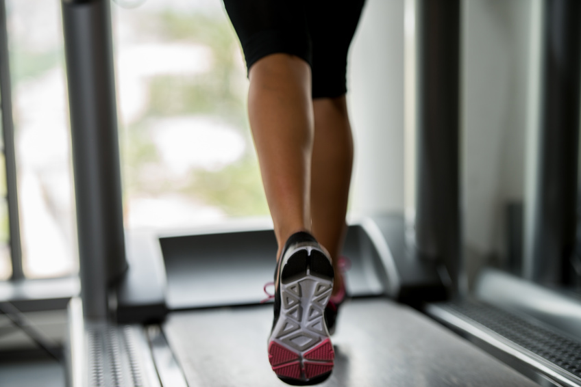 Woman running a treadmill.