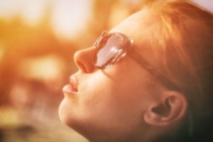 Woman looking up with self-compassion