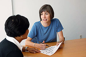 Lady meeting with a counselor for her child