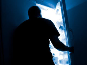 Man opening refrigerator