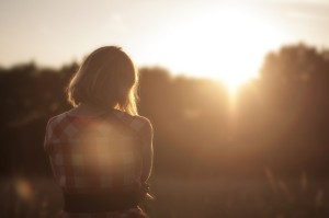 Woman looking at sunrise contemplating Binge eating disorder