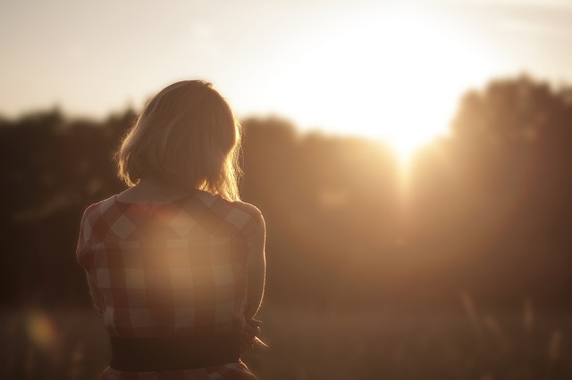 Woman looking at sunrise