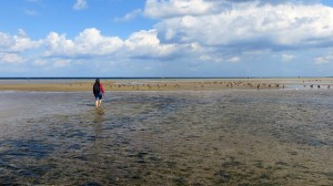 Woman on beach being a mentor to others struggling with ED