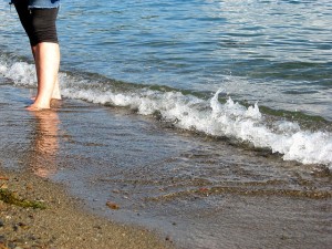 Lady's legs in the ocean as she is in anorexia recovery