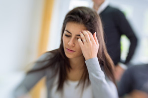 stressed young woman deep in thought about Co-Occurring Eating and Mood Disorders