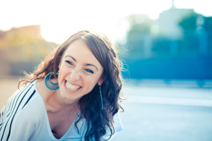 young beautiful brunette woman with smart phone