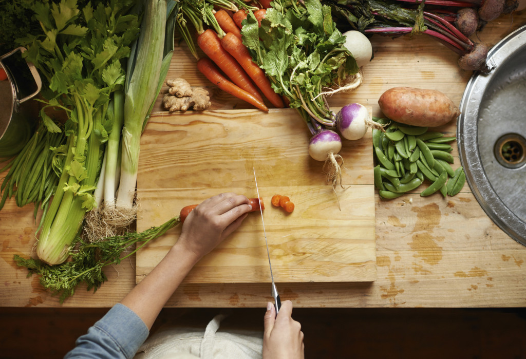 Woman with Orthorexia cutting vegetables