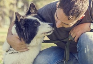 Man with his dog playing in the park