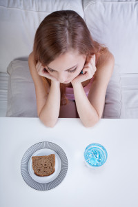 Young girl struggling with Common Feeding Disorders and not eating