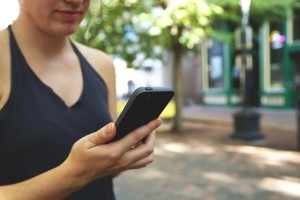 Woman walking while on social media