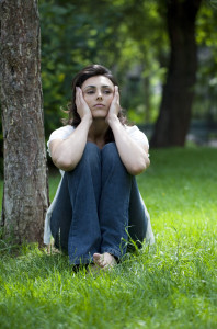 young woman destressing in a park