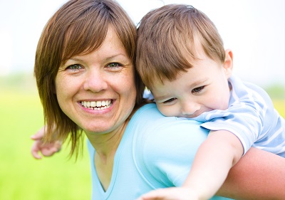 Mother playing with her son outdoors