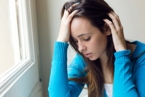 Depressed young woman thinking about the Pandemic