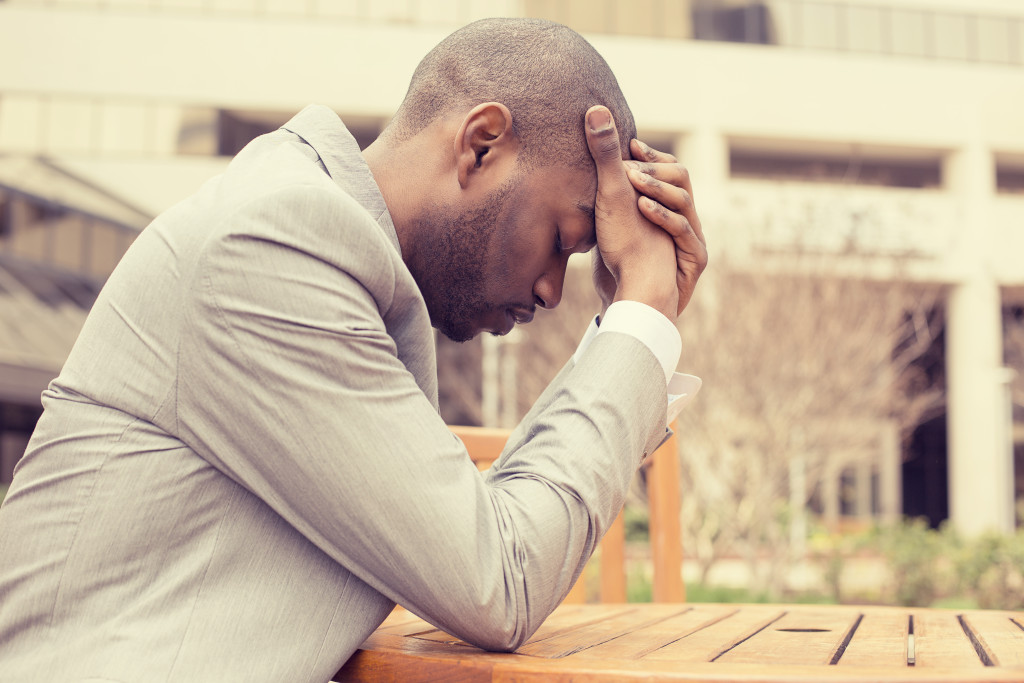 man stressed about compulsive overeating