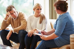 Counselor speaking with a couple in Day Treatment Program