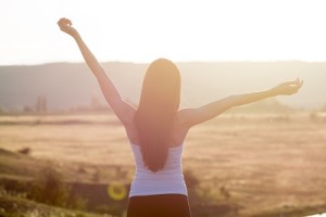 woman with open arms to sunrise using Dialectical Behavior Therapy