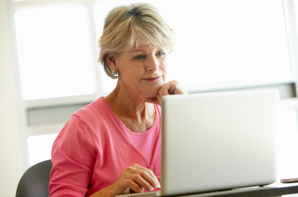 Mature Woman Looking At Eating Disorder Research On Her Computer