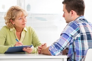 Doctor and patient discussing Outpatient treatment while in college