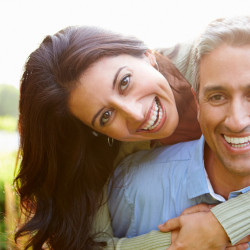 Portrait Of Loving Hispanic Couple In the Countryside