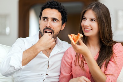 Couple eating pizza