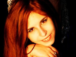 Girl with red hair smiling