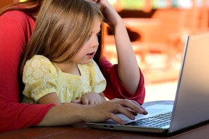 Child playing a computer game about healthy meals