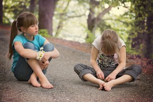 Kids sitting on the ground