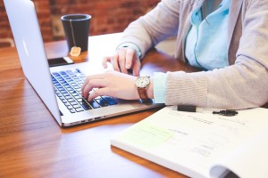 Lady using laptop to check out eating disorder forum