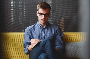 Man researching the psychopathology of males on his iPad