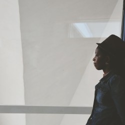 African American Woman thinking how Eating Disorders are Color Blind