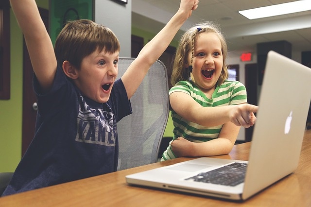 Children playing video game as a reward