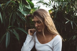 Woman severing relationship with family member over the phone.