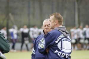 College coach speaking with a player