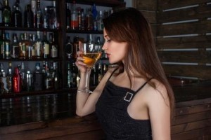 Woman battling drunkorexia