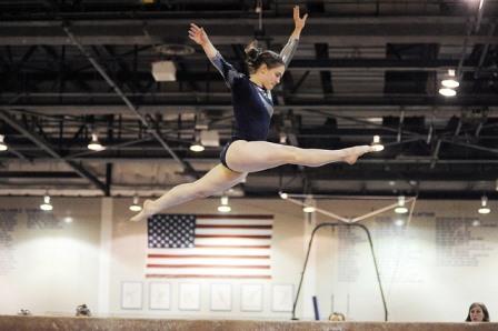 woman competing in gymnastics