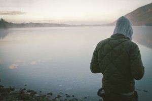 Man standing next to the lake