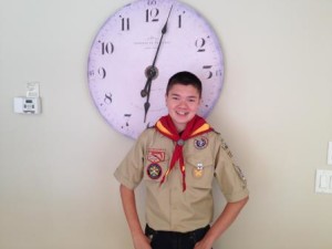 Young Boy Scout smiling.