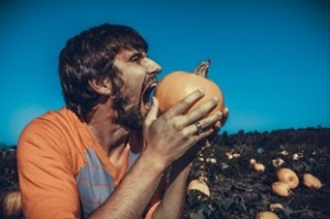 Man Eating a Pumpkin