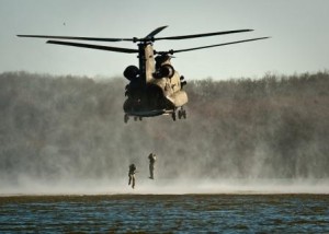 Soldiers jumping from a helicopter
